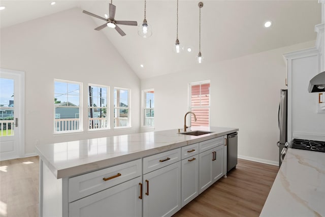 1104 62nd St, Galveston, TX 77551 - kitchen with a sink, appliances with stainless steel finishes, high vaulted ceiling, recessed lighting, and a ceiling fan
