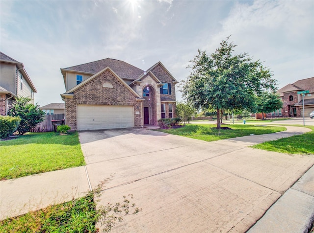 9110 Darby Park Ln, Richmond, TX 77407 - view of front of house with brick siding, concrete driveway, and a garage