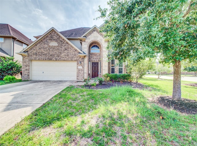 9110 Darby Park Ln, Richmond, TX 77407 - view of front of home featuring brick siding, an attached garage, driveway, and a front yard