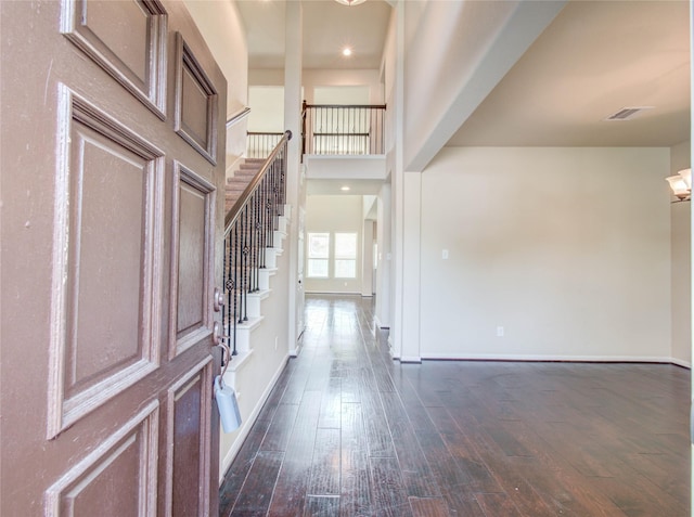 9110 Darby Park Ln, Richmond, TX 77407 - entryway featuring stairway and dark wood-type flooring