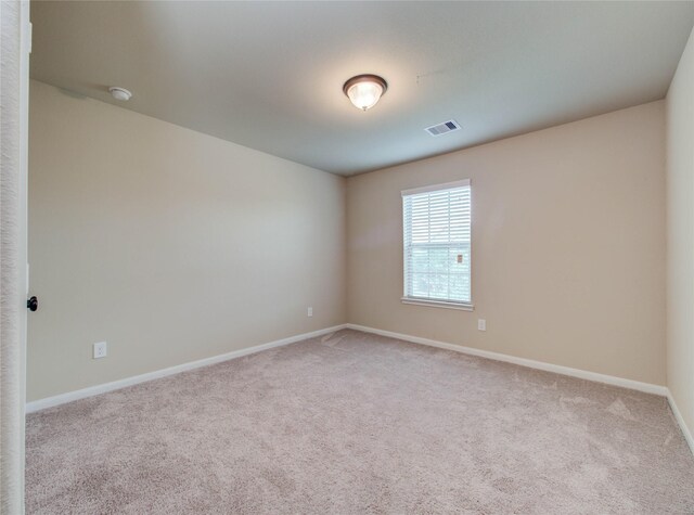9110 Darby Park Ln, Richmond, TX 77407 - carpeted empty room featuring baseboards and a smoke detector