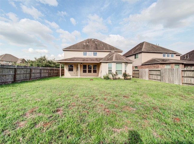 9110 Darby Park Ln, Richmond, TX 77407 - rear view of house with a fenced backyard