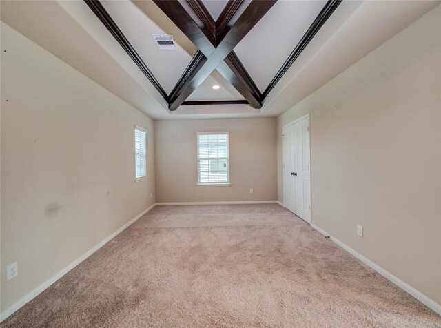 9110 Darby Park Ln, Richmond, TX 77407 - spare room featuring light colored carpet, beamed ceiling, coffered ceiling, and recessed lighting