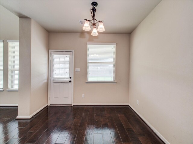 9110 Darby Park Ln, Richmond, TX 77407 - unfurnished dining area featuring a chandelier, wood-type flooring, and plenty of natural light