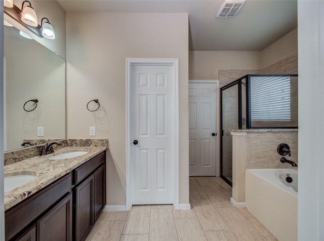 9110 Darby Park Ln, Richmond, TX 77407 - full bathroom featuring a bath, a shower stall, and double vanity