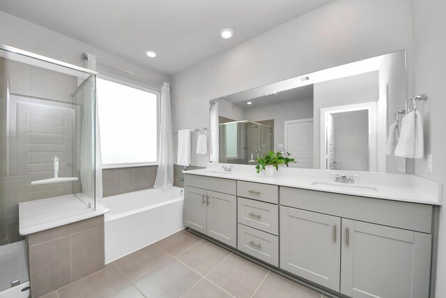 10053 Cloud Mist Dr, Houston, TX 77080 - full bathroom featuring a stall shower, double vanity, a bath, tile patterned floors, and recessed lighting