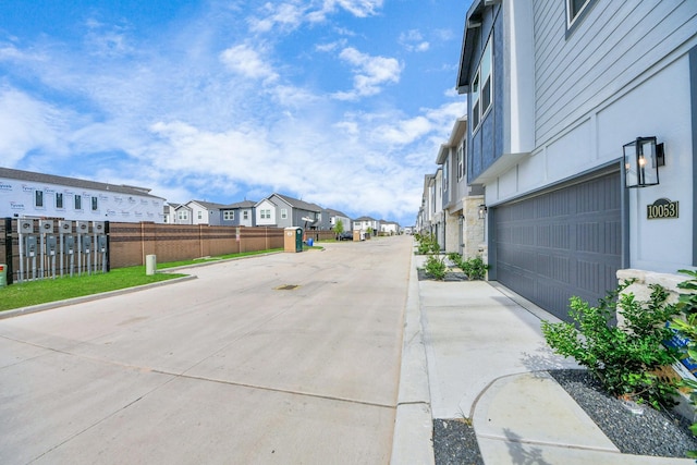 10053 Cloud Mist Dr, Houston, TX 77080 - view of concrete street with a residential view and curbs