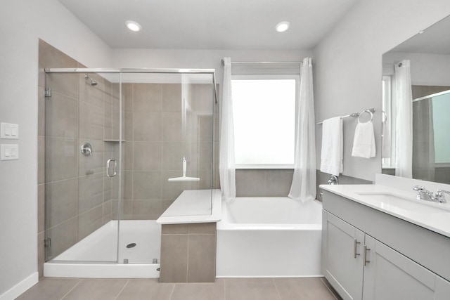 10053 Cloud Mist Dr, Houston, TX 77080 - full bathroom with vanity, a garden tub, a stall shower, and tile patterned floors