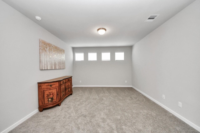 10053 Cloud Mist Dr, Houston, TX 77080 - spare room featuring light carpet, baseboards, and a smoke detector