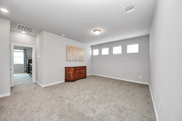 10053 Cloud Mist Dr, Houston, TX 77080 - carpeted empty room featuring healthy amount of natural light, baseboards, and recessed lighting