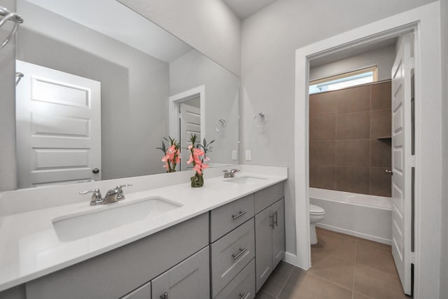 10053 Cloud Mist Dr, Houston, TX 77080 - full bath featuring toilet, double vanity, tile patterned floors, and  shower combination