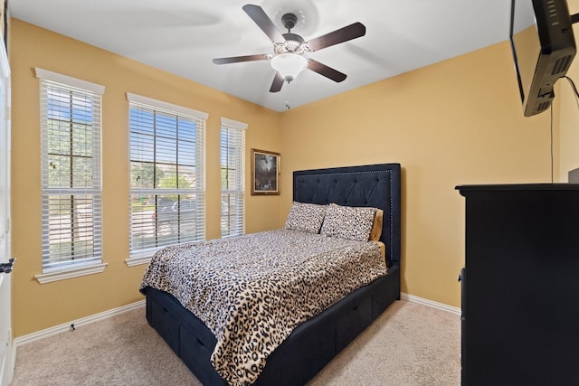 8014 Grove Sky Ct, Richmond, TX 77407 - carpeted bedroom with baseboards and ceiling fan