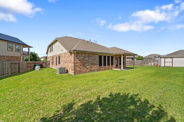 8014 Grove Sky Ct, Richmond, TX 77407 - back of property with brick siding and central AC
