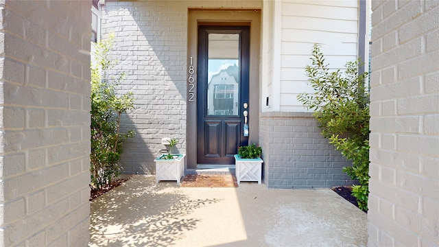 18622 Courteous Way, Cypress, TX 77433 - view of exterior entry featuring brick siding