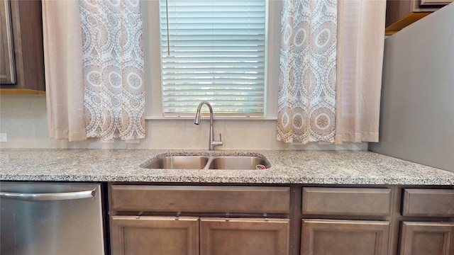 18622 Courteous Way, Cypress, TX 77433 - kitchen featuring dishwasher, a sink, and light stone counters