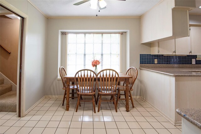 5150 Sandy Creek Ln, Brenham, TX 77833 - dining space featuring stairway, a ceiling fan, ornamental molding, light tile patterned floors, and baseboards