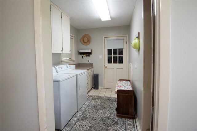 5150 Sandy Creek Ln, Brenham, TX 77833 - laundry room with cabinet space, independent washer and dryer, and light tile patterned floors
