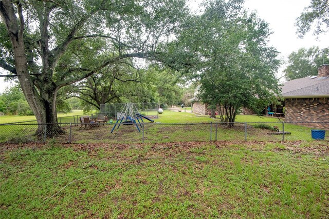 5150 Sandy Creek Ln, Brenham, TX 77833 - view of yard with a playground