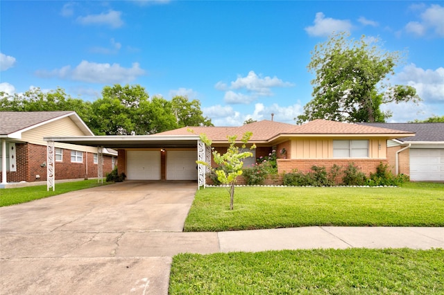 705 Kalmer St, Pasadena, TX 77502 - single story home with brick siding, an attached garage, concrete driveway, a front yard, and board and batten siding