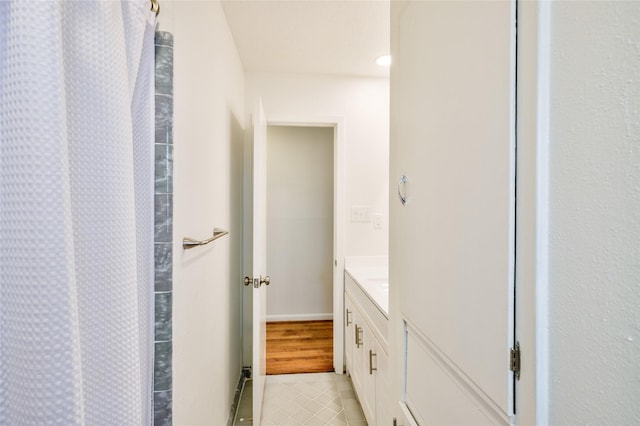 705 Kalmer St, Pasadena, TX 77502 - bathroom with vanity, tile patterned floors, and a shower with shower curtain