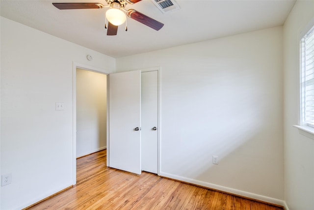 705 Kalmer St, Pasadena, TX 77502 - unfurnished bedroom with light wood-style flooring, baseboards, a closet, and a ceiling fan