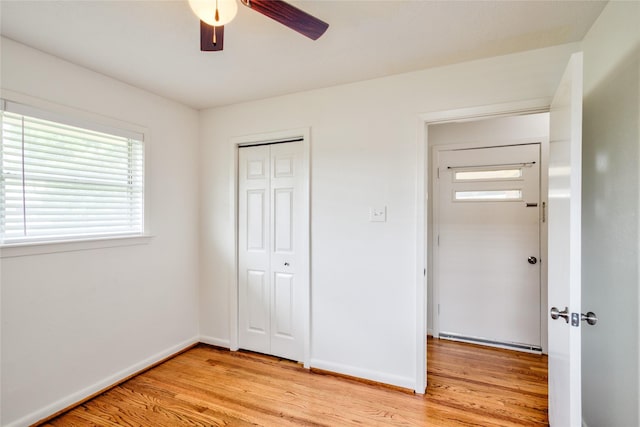 705 Kalmer St, Pasadena, TX 77502 - unfurnished bedroom featuring light wood-type flooring, a closet, baseboards, and ceiling fan