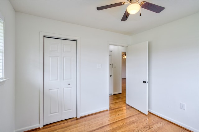 705 Kalmer St, Pasadena, TX 77502 - unfurnished bedroom featuring light wood finished floors, a closet, baseboards, and ceiling fan