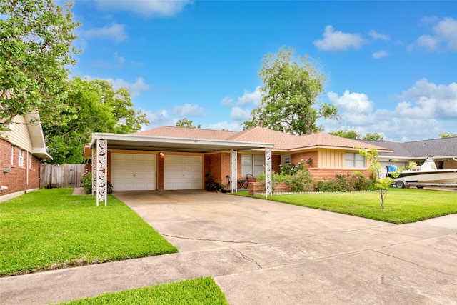 705 Kalmer St, Pasadena, TX 77502 - ranch-style home with a garage, brick siding, and concrete driveway