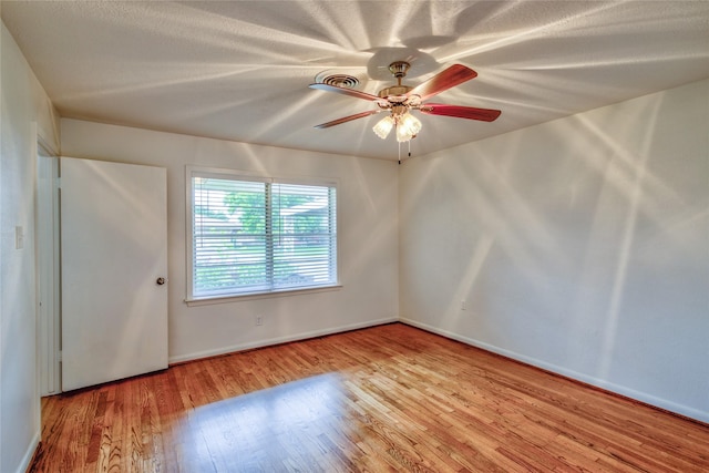 705 Kalmer St, Pasadena, TX 77502 - empty room featuring wood finished floors, a ceiling fan, and baseboards