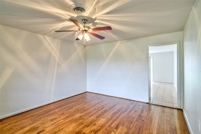 705 Kalmer St, Pasadena, TX 77502 - empty room with wood finished floors, ceiling fan, and baseboards