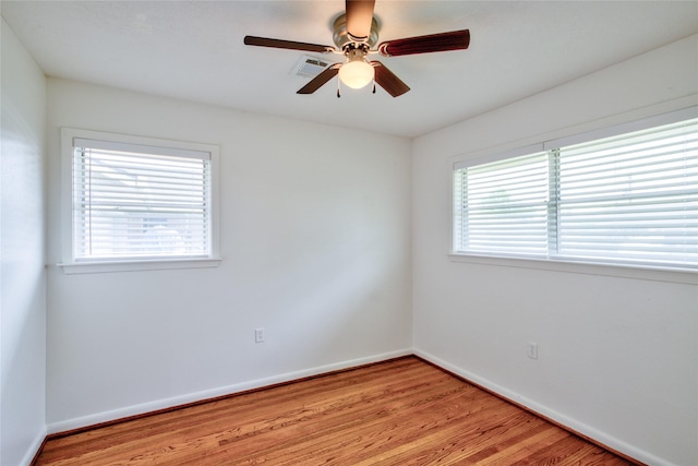 705 Kalmer St, Pasadena, TX 77502 - empty room featuring light wood-style flooring, baseboards, and a ceiling fan
