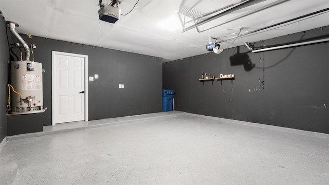 10811 Waterfern Ct, Houston, TX 77064 - garage with gas water heater, a garage door opener, and baseboards