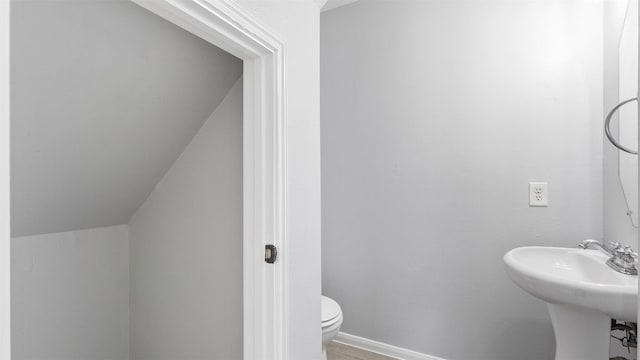 10811 Waterfern Ct, Houston, TX 77064 - bathroom with toilet, baseboards, and a sink