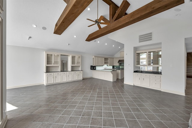 22 Creekwood Dr, Montgomery, TX 77356 - unfurnished living room with tile patterned floors, high vaulted ceiling, beam ceiling, a ceiling fan, and recessed lighting