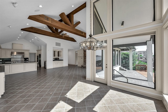 22 Creekwood Dr, Montgomery, TX 77356 - unfurnished dining area with high vaulted ceiling, a chandelier, recessed lighting, dark tile patterned flooring, and baseboards