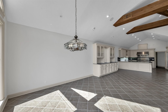 22 Creekwood Dr, Montgomery, TX 77356 - kitchen featuring a chandelier, cream cabinetry, beam ceiling, high vaulted ceiling, and dark countertops