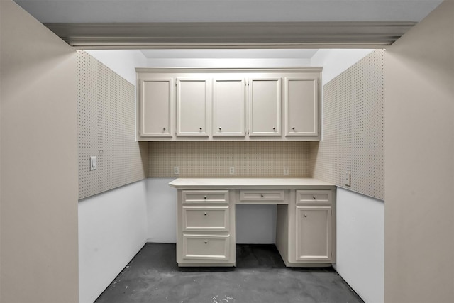 22 Creekwood Dr, Montgomery, TX 77356 - unfurnished office with unfinished concrete floors and built in study area