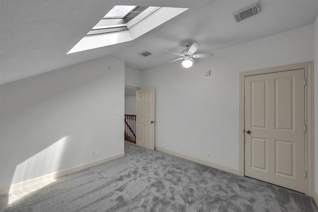 22 Creekwood Dr, Montgomery, TX 77356 - bonus room featuring a skylight, carpet, baseboards, a ceiling fan, and vaulted ceiling