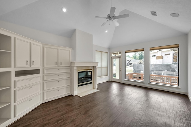 22 Creekwood Dr, Montgomery, TX 77356 - unfurnished living room with a ceiling fan, high vaulted ceiling, a glass covered fireplace, dark wood-style flooring, and recessed lighting