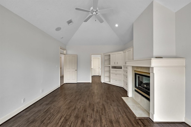 22 Creekwood Dr, Montgomery, TX 77356 - unfurnished living room with baseboards, ceiling fan, high vaulted ceiling, dark wood-style floors, and a fireplace with flush hearth