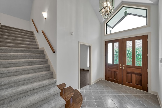 22 Creekwood Dr, Montgomery, TX 77356 - entrance foyer featuring stairway, high vaulted ceiling, a chandelier, and tile patterned flooring
