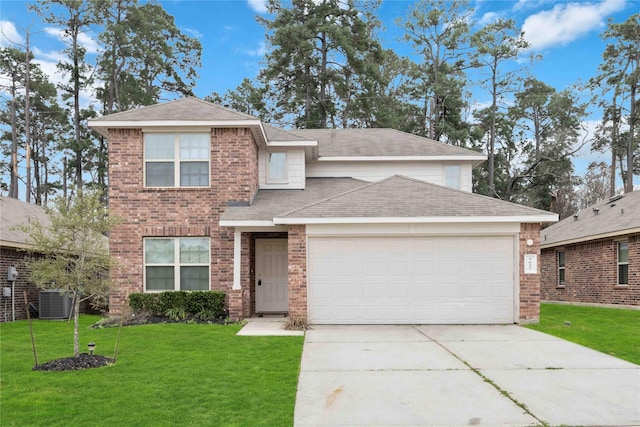 5627 Rainflower Terrace Ln, Spring, TX 77389 - traditional-style home featuring central AC unit, driveway, an attached garage, a front lawn, and brick siding