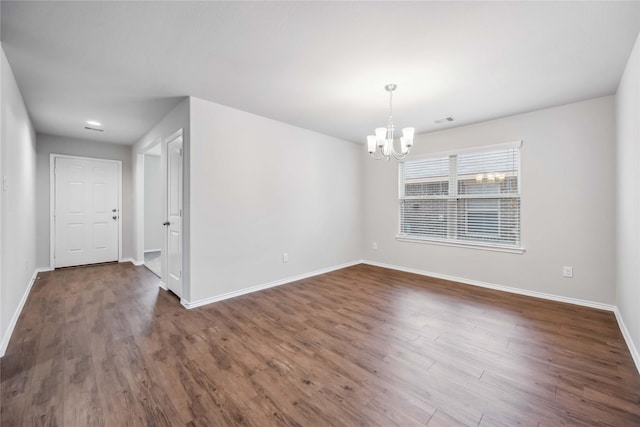 5627 Rainflower Terrace Ln, Spring, TX 77389 - spare room featuring a chandelier, baseboards, and dark wood-type flooring