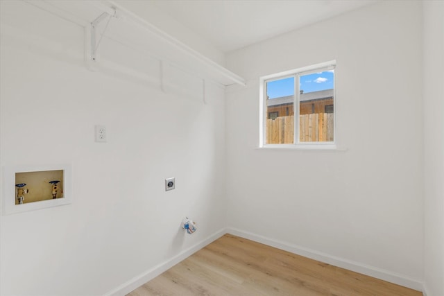 5511 Hickory Forest Dr, Houston, TX 77088 - washroom featuring electric dryer hookup, hookup for a washing machine, light wood finished floors, and baseboards