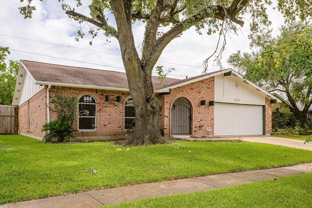 5511 Hickory Forest Dr, Houston, TX 77088 - view of front of home featuring brick siding, a garage, a shingled roof, and concrete driveway