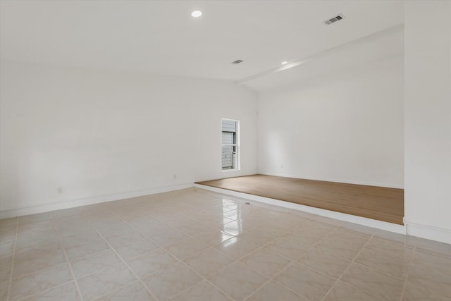 5511 Hickory Forest Dr, Houston, TX 77088 - empty room featuring vaulted ceiling, light tile patterned floors, baseboards, and recessed lighting