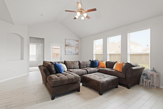 14615 Olive Sparrow Ln, Houston, TX 77049 - living area featuring a ceiling fan, vaulted ceiling, baseboards, and light wood-type flooring