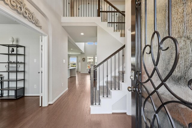 3651 Lake Bend Shore Dr, Spring, TX 77386 - entrance foyer with wood finished floors, baseboards, stairs, and a high ceiling