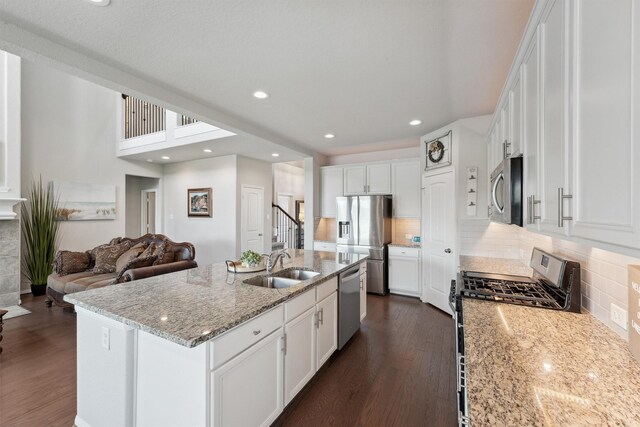 3651 Lake Bend Shore Dr, Spring, TX 77386 - kitchen featuring stainless steel appliances, a sink, dark wood-type flooring, white cabinets, and recessed lighting