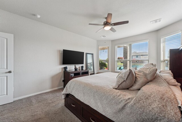 3651 Lake Bend Shore Dr, Spring, TX 77386 - bedroom featuring baseboards, carpet flooring, and ceiling fan